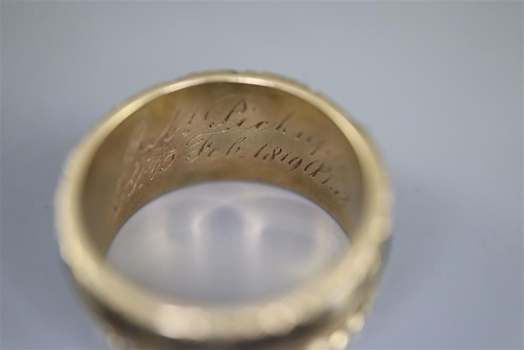 A George III gold and black enamel memorial ring with hairwork panel and a matching brooch,